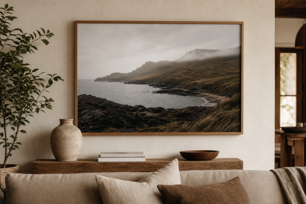 Framed landscape photography print above a calm neutral interior