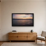 Room visualisation of Crossing at Dawn in a black frame, shown at 80 x 45 cm