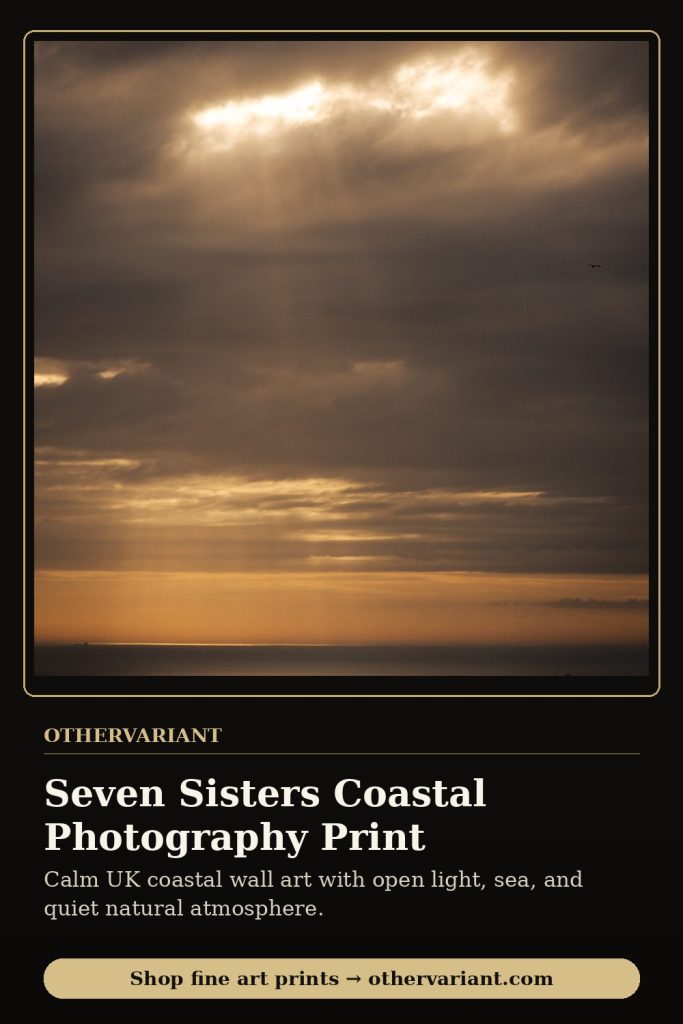 A restrained coastal landscape photograph of the Seven Sisters cliffs with soft light over the sea, used as an example of timeless landscape wall art.