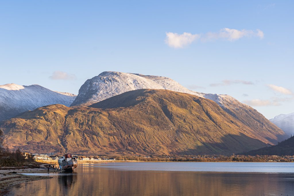 Ben Nevis above Loch Linnhe with the Old Boat of Caol near Fort William in warm winter light
