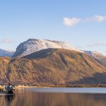 Ben Nevis above Loch Linnhe with the Old Boat of Caol near Fort William in warm winter light