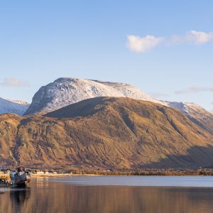 Ben Nevis above Loch Linnhe with the Old Boat of Caol near Fort William in warm winter light