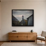 Room visualisation of Storm Over the Belfry in a black frame, shown at 80 x 60 cm
