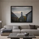 Room visualisation of Storm Over the Belfry in a black frame, shown at 80 x 60 cm