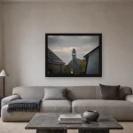Room visualisation of Storm Over the Belfry in a black frame, shown at 60 x 45 cm