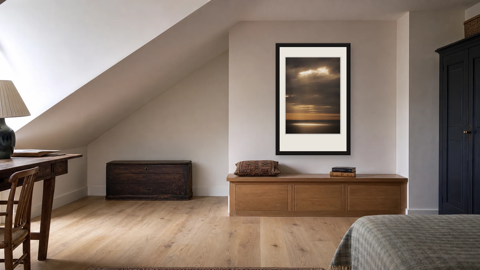 Light Break Seven Sisters photography print on the full-height wall beside a sloping loft ceiling
