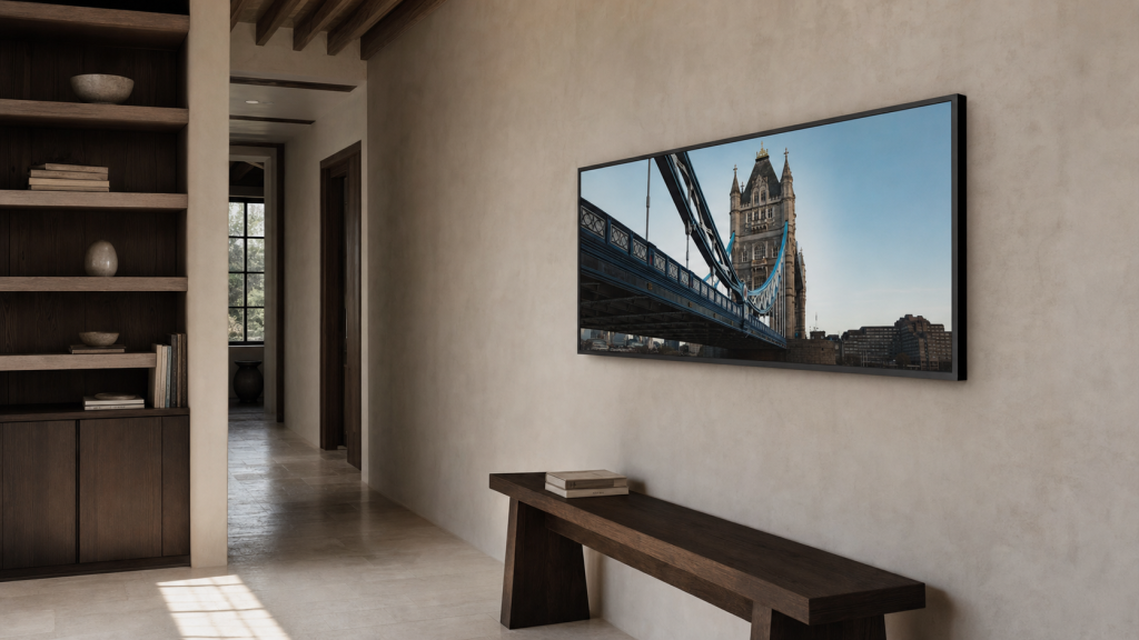 A wide London architecture photography print on a long hallway wall above a dark wooden bench