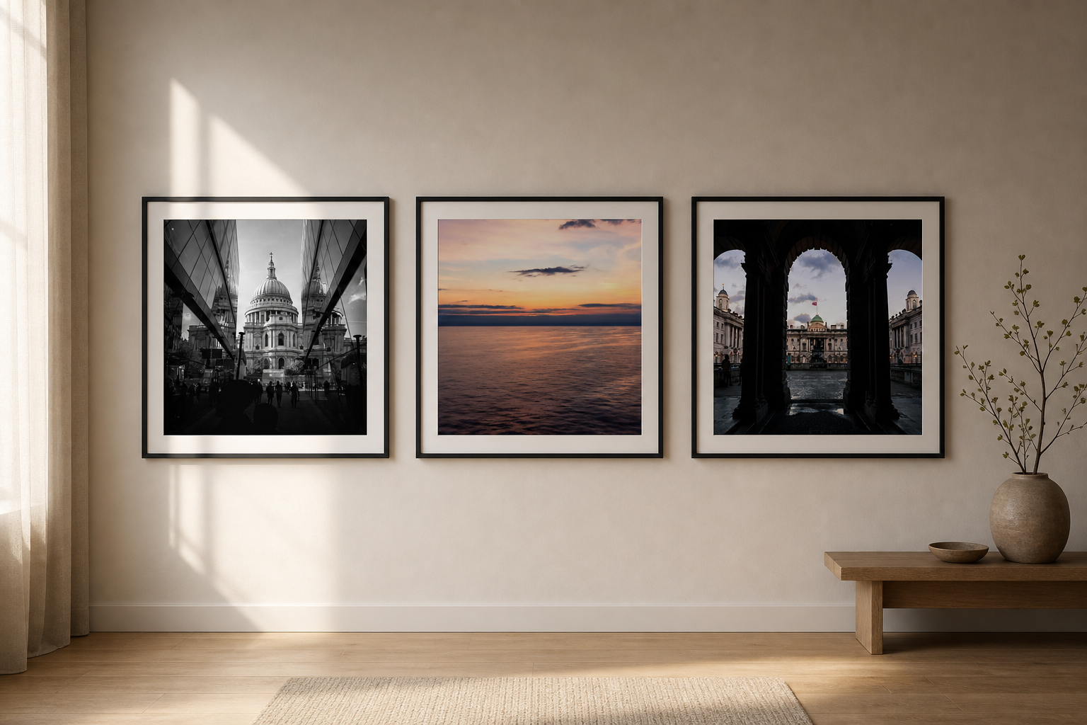 Three framed photography prints arranged as a calm gallery wall on a warm neutral interior wall.